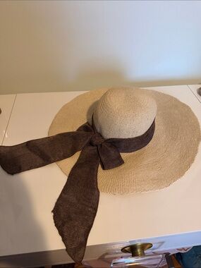 Beige Straw Wide-Brim Hat with Brown Ribbon Accent